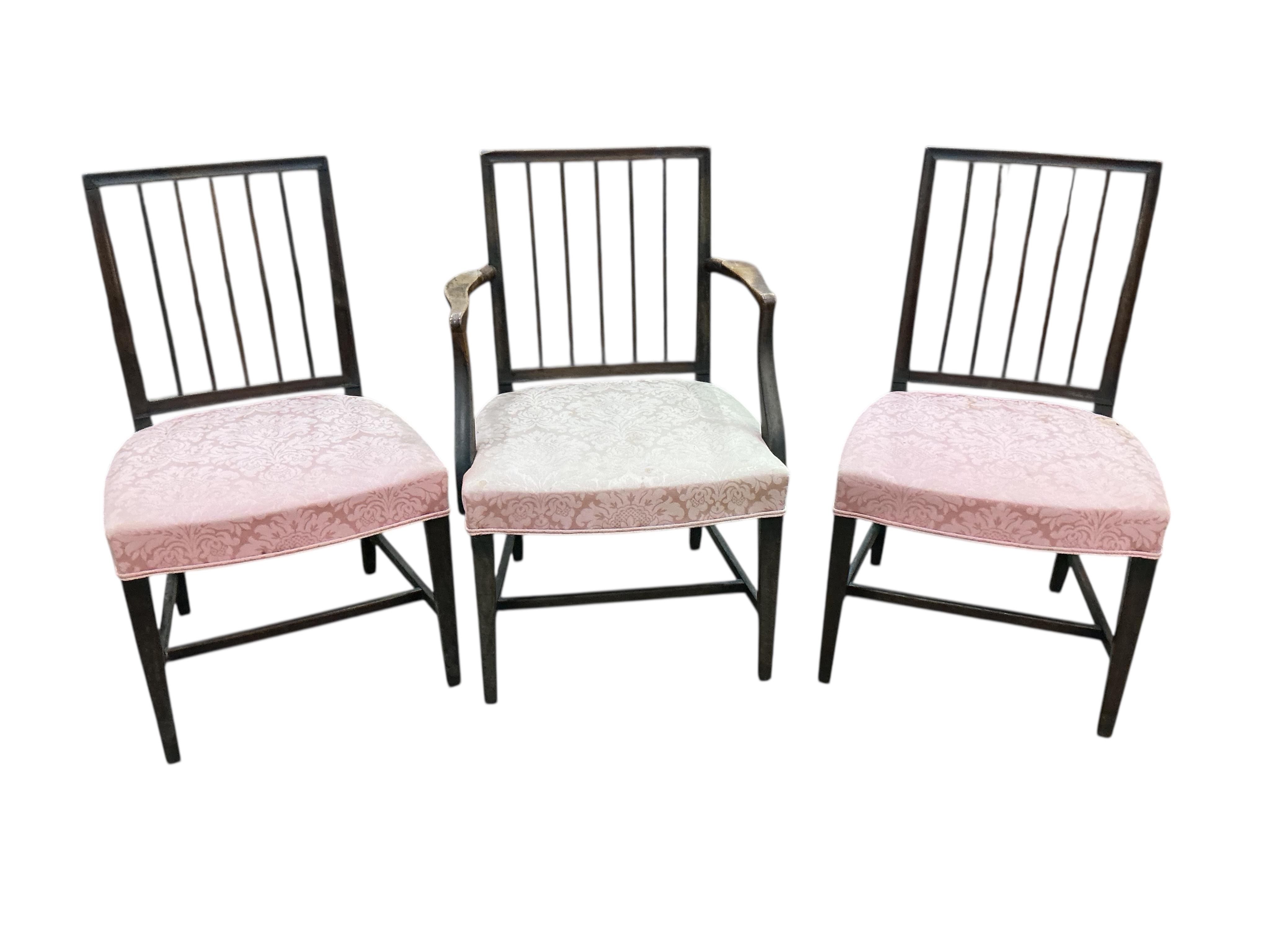 A set of six George III mahogany dining chairs, one with arms